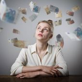 Girl in white and falling Euro banknotes. Currency and lottery concept. Young slim woman.